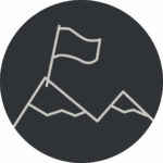 Ein Kreis mit einem Icon. Das Icon zeigt Berge und eine Flagge an der Bergspitze